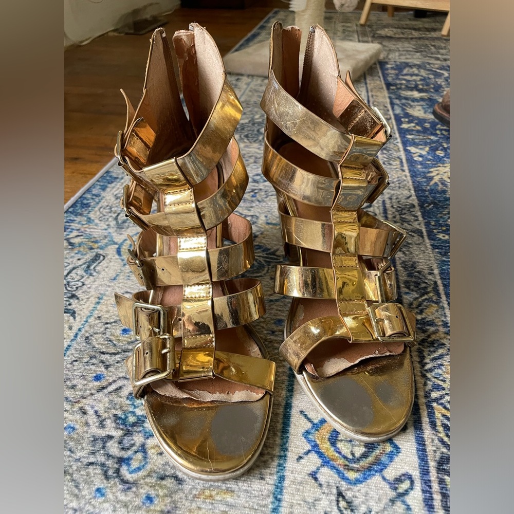 Metallic gold buckle heels